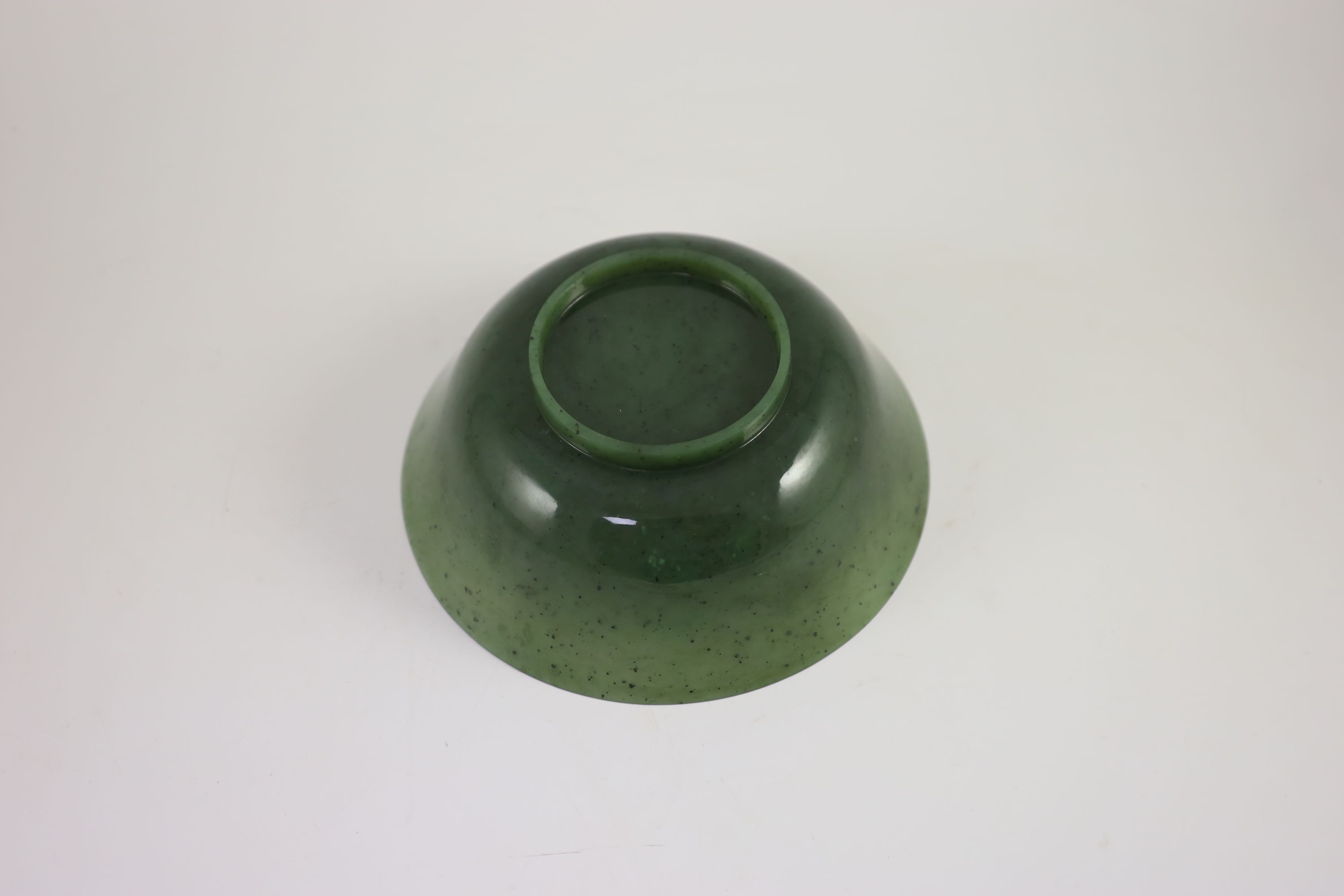A Chinese spinach green jade bowl, 19th century 22 cm diameter